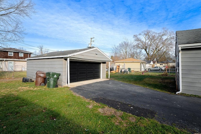 garage featuring a lawn