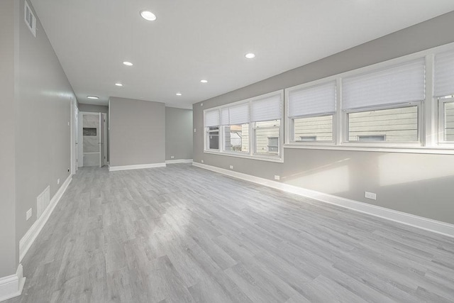 unfurnished living room with light wood-type flooring