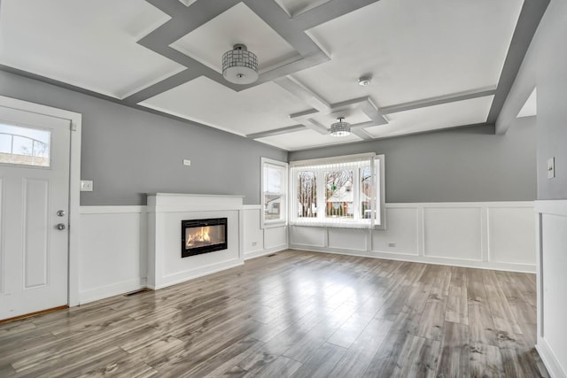 16542 Paulina St, Markham, IL 60428 - unfurnished living room with visible vents, wood finished floors, a glass covered fireplace, coffered ceiling, and a ceiling fan