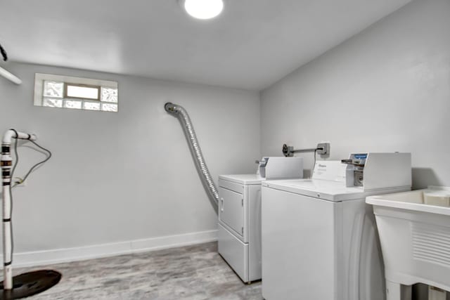 16542 Paulina St, Markham, IL 60428 - washroom with washing machine and dryer, baseboards, and a sink