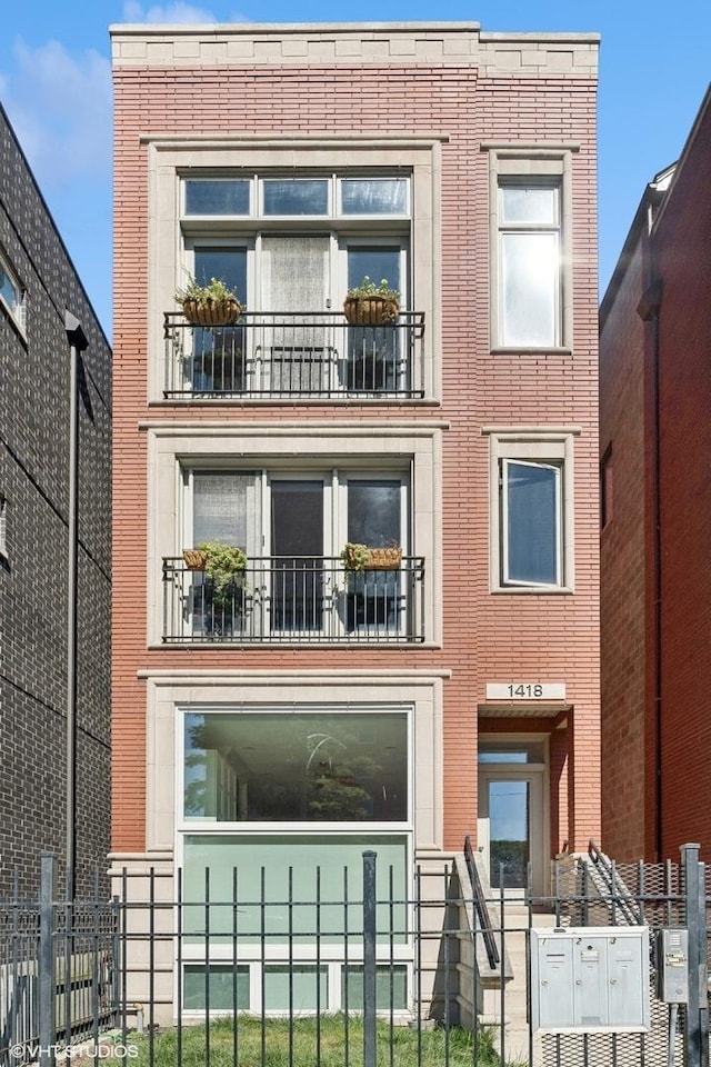 view of front of house featuring a balcony