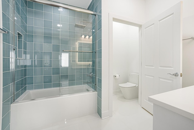 full bathroom with tile patterned flooring, toilet, combined bath / shower with glass door, and vanity