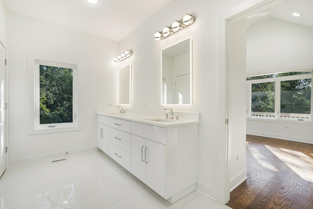 bathroom with tile patterned floors and vanity