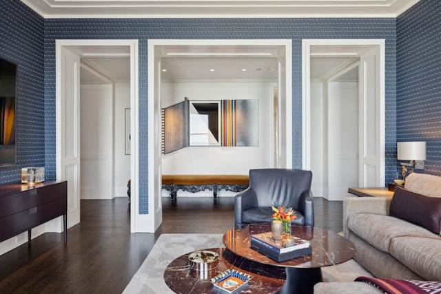 living room featuring wood-type flooring and ornamental molding