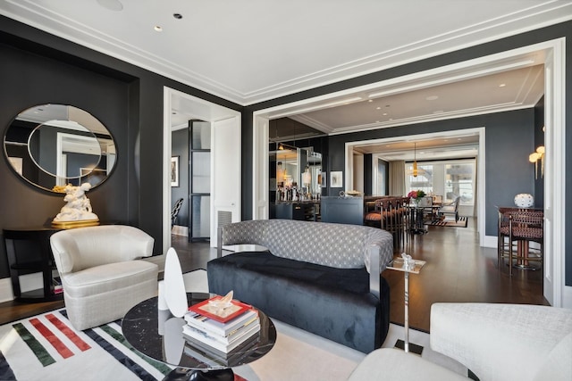 living room with dark hardwood / wood-style floors and crown molding