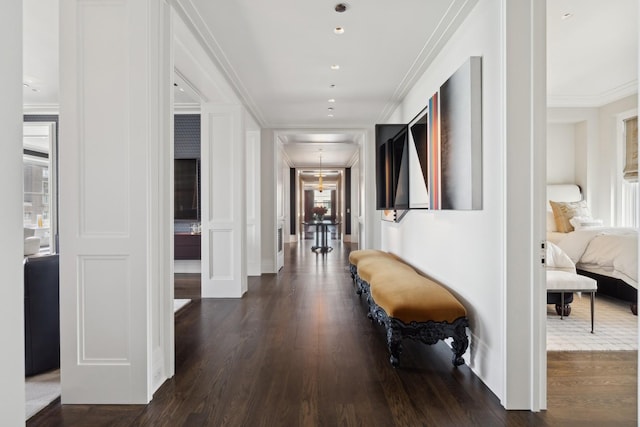 hallway featuring dark hardwood / wood-style floors and ornamental molding