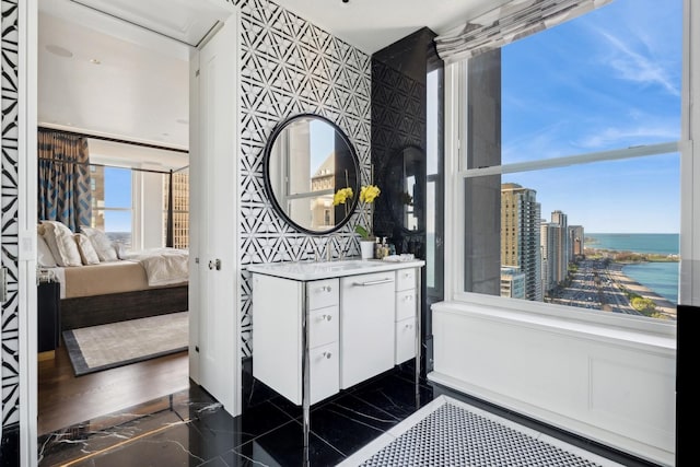 bathroom with vanity and a water view