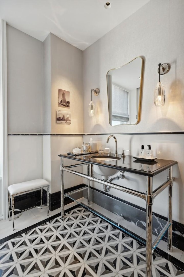 kitchen featuring tile patterned floors and sink