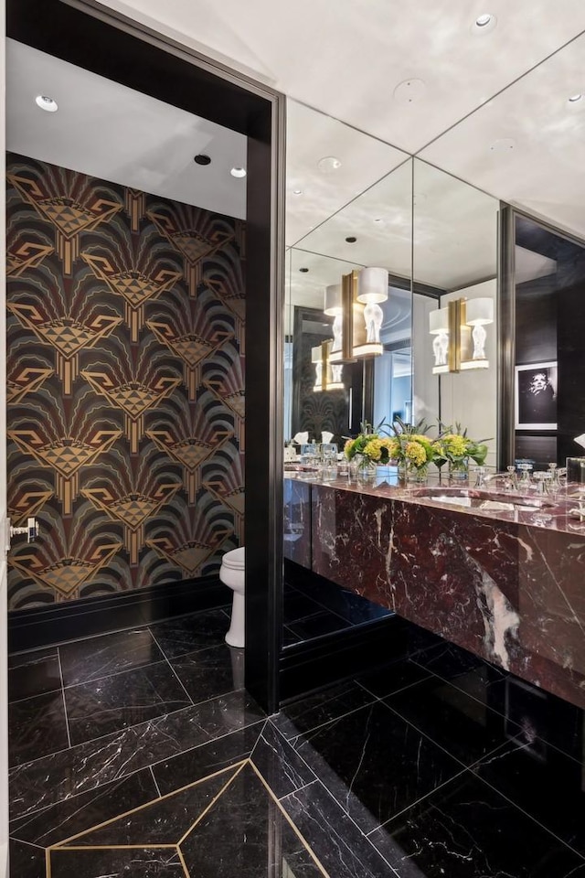 bathroom with vanity and toilet