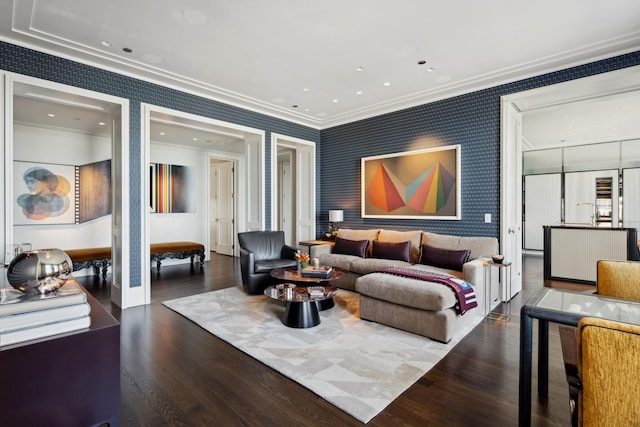 living room with dark hardwood / wood-style floors and crown molding