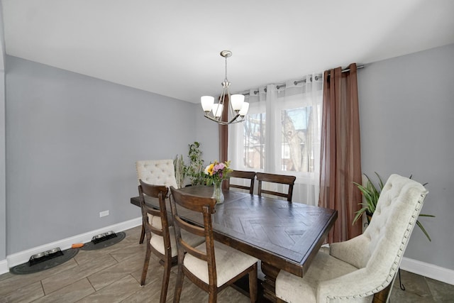 dining room featuring a chandelier