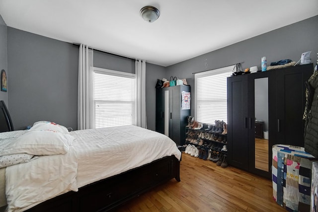 bedroom with hardwood / wood-style flooring