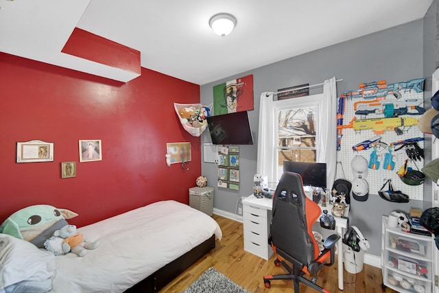 bedroom featuring light wood-type flooring