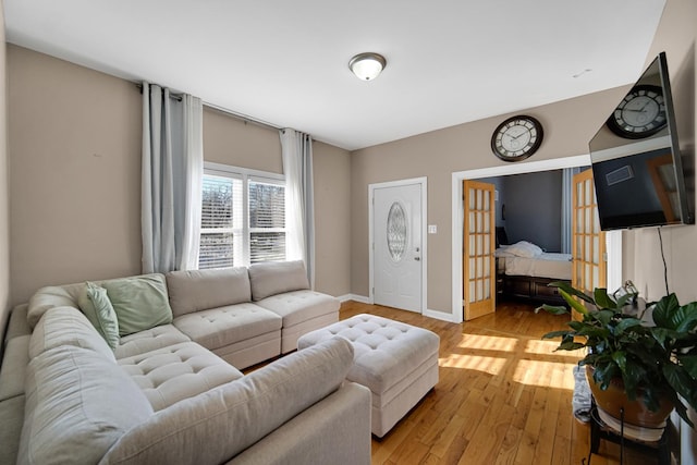 living room with light hardwood / wood-style floors