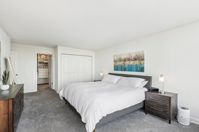 bedroom featuring a closet and dark carpet