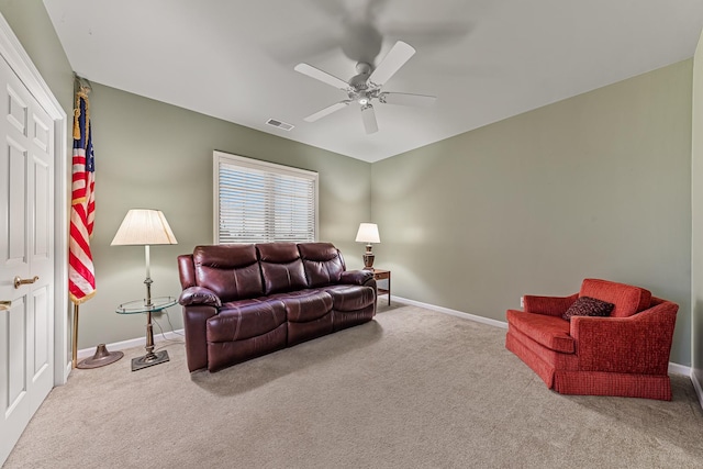 carpeted living room featuring ceiling fan