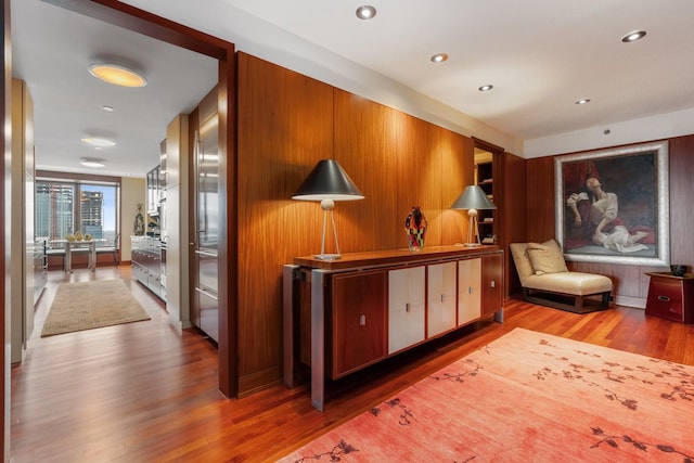 corridor with light hardwood / wood-style flooring