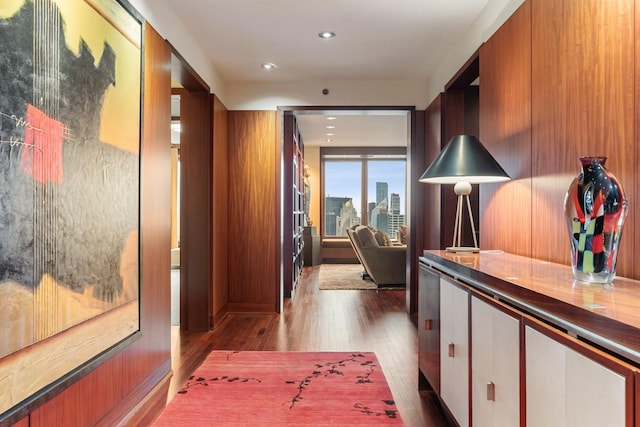 hallway with dark hardwood / wood-style flooring