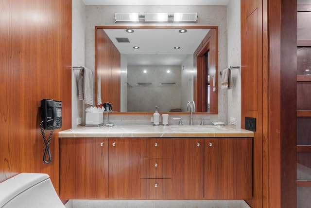 bathroom with vanity and toilet