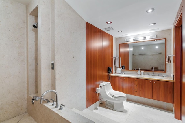 bathroom featuring tile patterned floors, toilet, wooden walls, a bathtub, and vanity