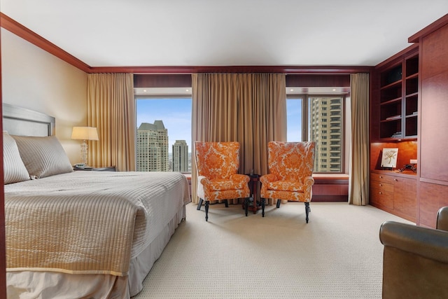 bedroom featuring light carpet and access to outside