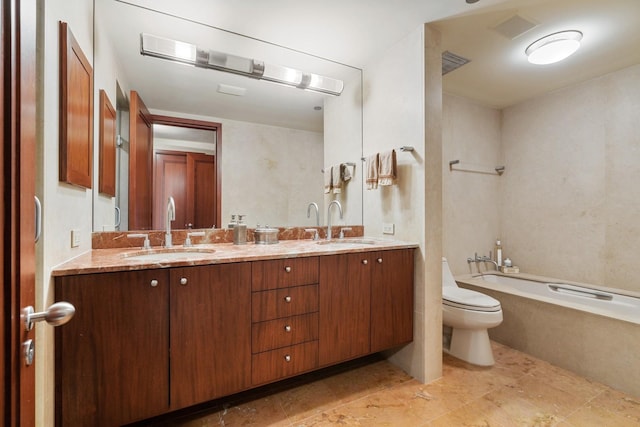 full bathroom with vanity, toilet, and tiled shower / bath combo