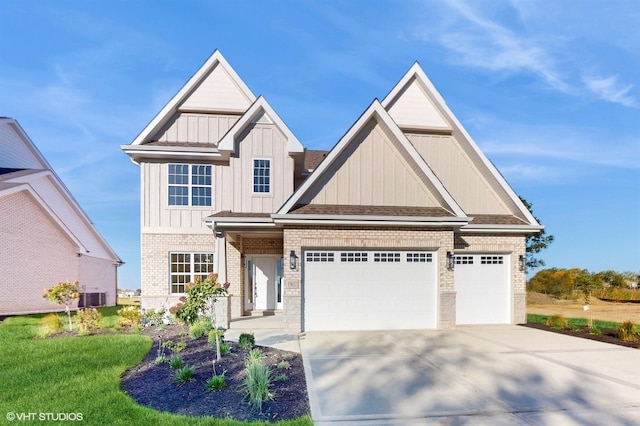 craftsman inspired home with central AC unit and a garage