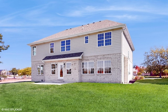 rear view of house with a yard