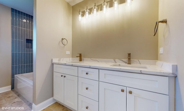 bathroom with vanity and tiled shower / bath