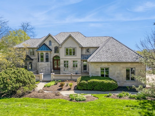 rear view of property with a yard and french doors