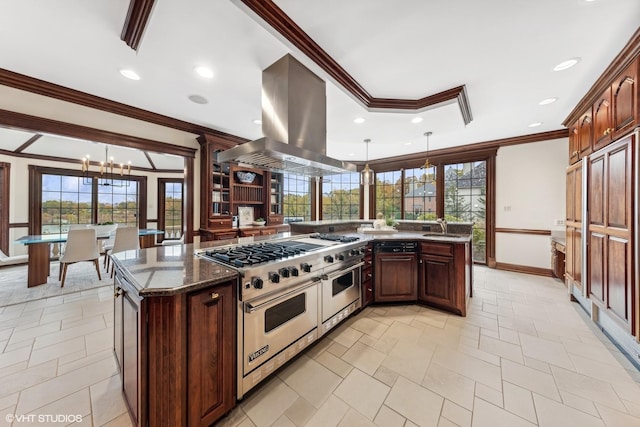 kitchen featuring pendant lighting, double oven range, dark stone counters, a notable chandelier, and island exhaust hood