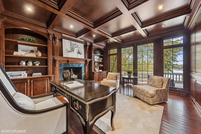 office space with wooden ceiling, coffered ceiling, crown molding, wooden walls, and built in features