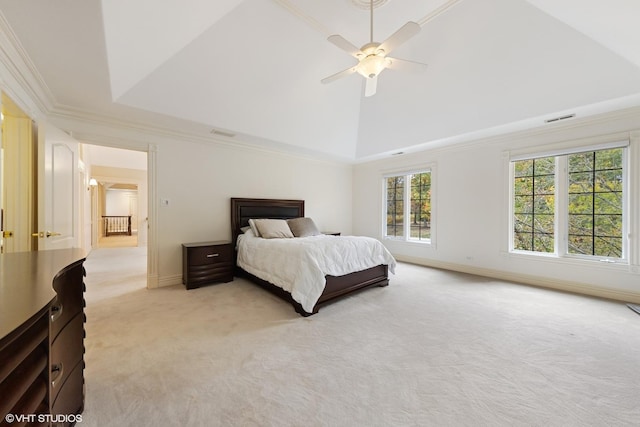 carpeted bedroom with high vaulted ceiling, a raised ceiling, ceiling fan, and ornamental molding