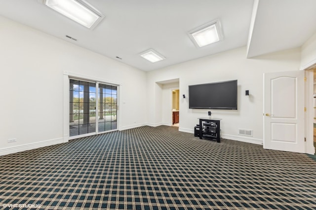 unfurnished living room with carpet