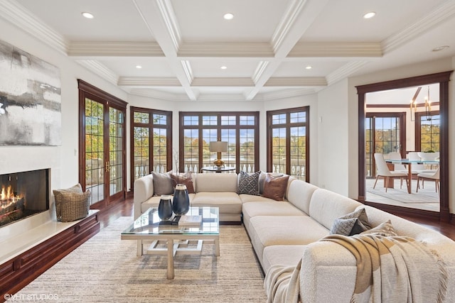 living room featuring french doors, coffered ceiling, beamed ceiling, crown molding, and hardwood / wood-style flooring