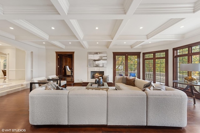 living room featuring french doors, coffered ceiling, beamed ceiling, dark hardwood / wood-style floors, and decorative columns