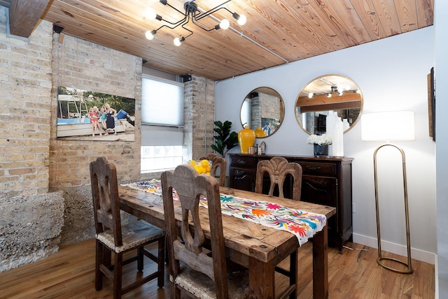 dining room featuring wood ceiling, plenty of natural light, and light hardwood / wood-style floors