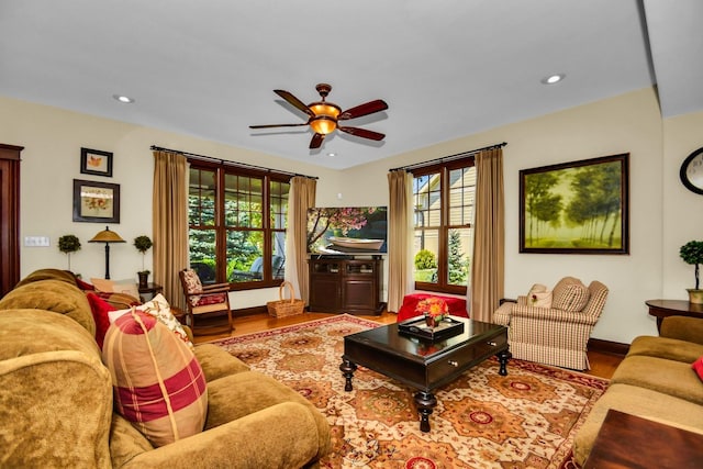 living room with hardwood / wood-style floors and ceiling fan