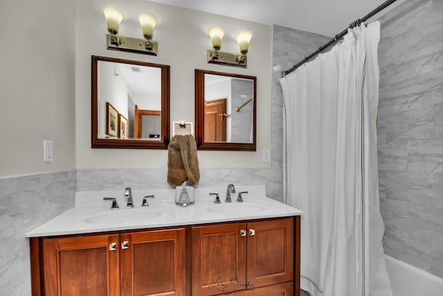 bathroom featuring vanity and shower / bathtub combination with curtain