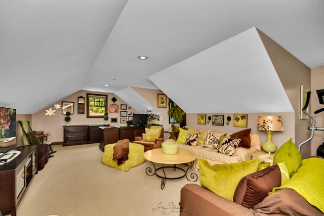 carpeted living room featuring vaulted ceiling