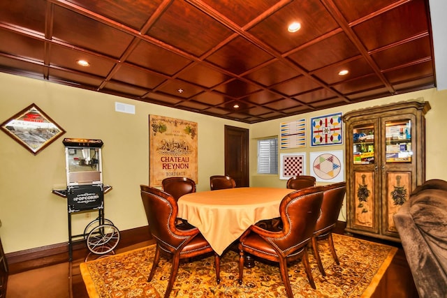 dining space with wooden ceiling and coffered ceiling