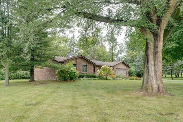 view of yard featuring a garage