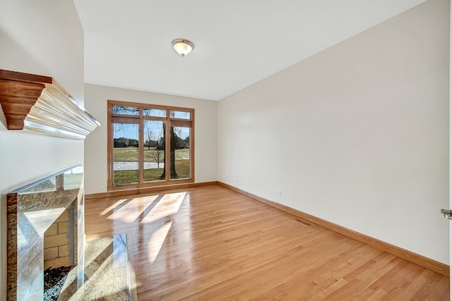 unfurnished room featuring light hardwood / wood-style floors