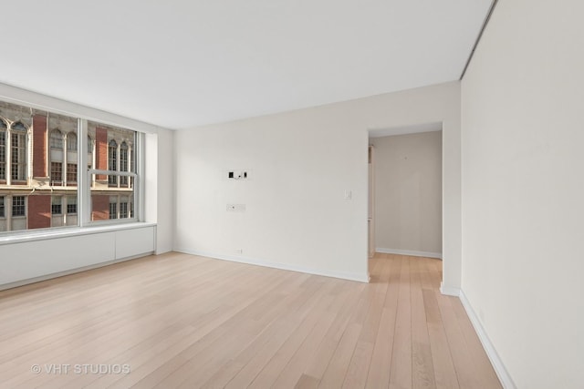 unfurnished room featuring light hardwood / wood-style flooring