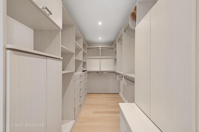 spacious closet featuring light hardwood / wood-style flooring