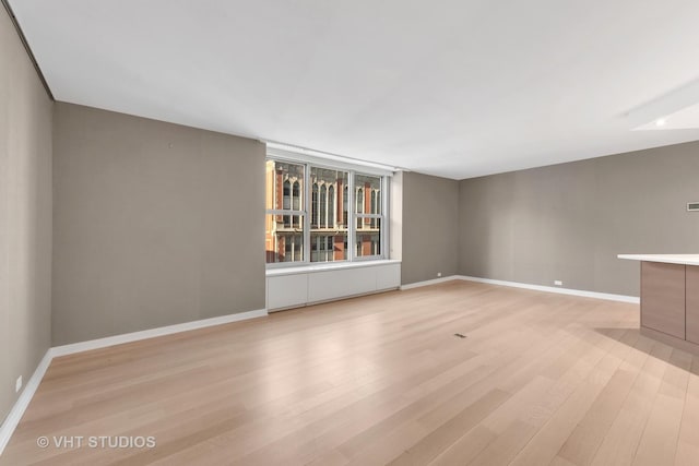 unfurnished living room featuring light hardwood / wood-style flooring