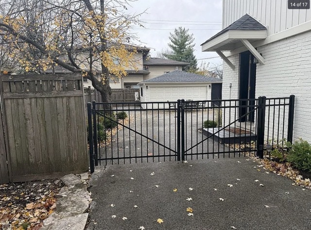 view of gate featuring an outdoor structure