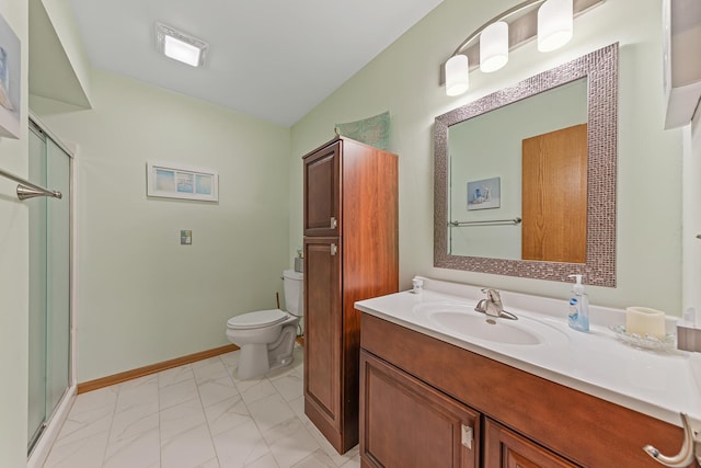 bathroom with vanity, toilet, and walk in shower