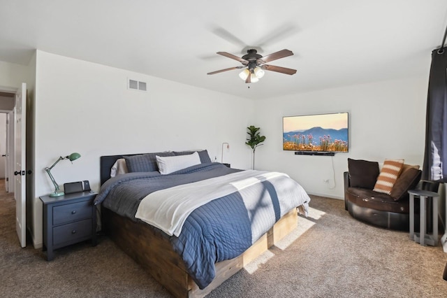 bedroom featuring ceiling fan and light carpet