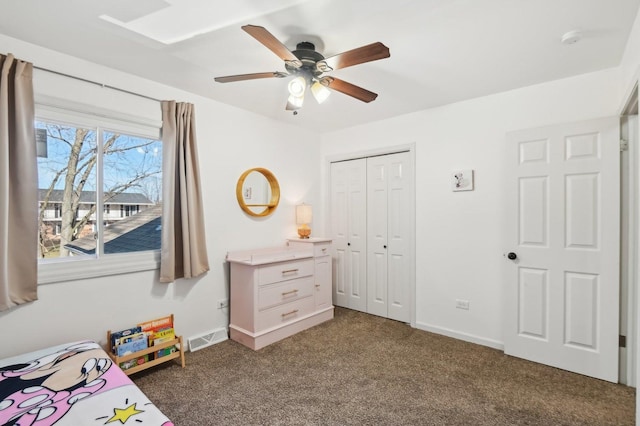 carpeted bedroom featuring a closet and ceiling fan